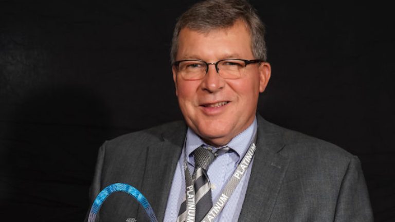 Russ Taylor being presented with Cartus Award
