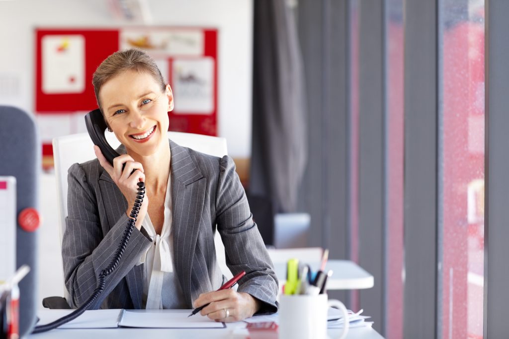 Woman on the phone at a desk